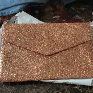 Hand clutch/press with gold straps